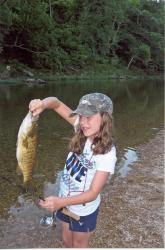 Click to enlarge image Jenna and her Bass - Fish from your Canoe or the River Bank - 